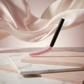 Pink flex tower brush with a cityscape background