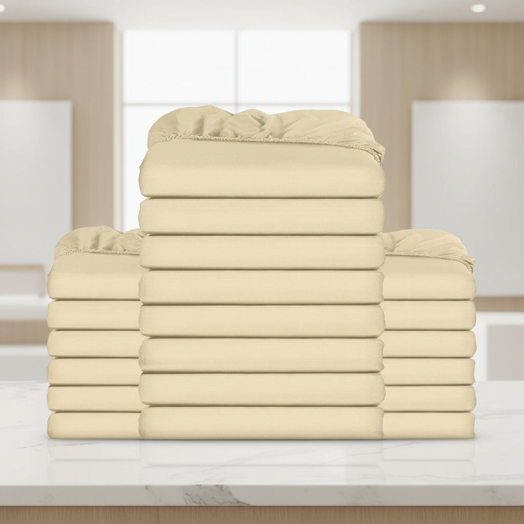 Stack of beige folded towels on a white background