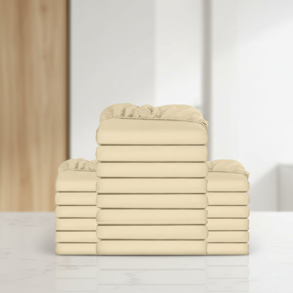 Stack of beige folded towels on a white background
