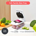 Vegetable chopper with onions and broccoli on a kitchen counter
