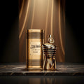 Gold and bronze 'Jean Paul Gaultier Le Male Elixir' perfume bottle and packaging on a white background
