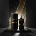 Black and gold Jean Paul Gaultier Le Male perfume bottle and packaging on a white background